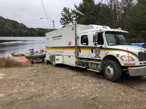 Police divers retrieved human remains from Lac McFee, about an hour north of Ottawa, earlier this month.