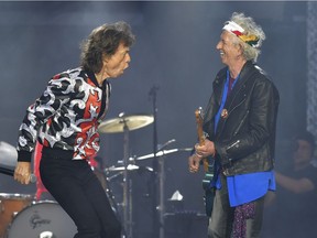 In this May 25, 2018 file photo, Mick Jagger, left, and Keith Richards, of The Rolling Stones, perform during their No Filter tour in London.