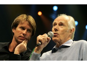 FILE - In this May 24, 2006 file photo, Giles Martin, left, listens as his father, original Beatles producer George Martin speaks after a sneak preview of a new Beatles-themed Cirque du Soleil show, "Love," in Las Vegas. Giles Martin has reached into the treasure trove of original recording sessions to remix key albums by John, Paul, George and Ringo. Last year he remixed "Sgt. Pepper's Lonely Hearts Club Band" and returns this year with a fascinating and exhaustive look at "The Beatles," better known as the "White Album," which contains such classics as "Back in the U.S.S.R." to "Blackbird" and "Ob-La-Di, Ob-La-Da." It coincides with celebrations for the album's 50th birthday.