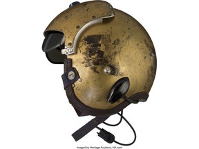 This undated photo provided by Heritage Auctions shows a helmet worn by John Glenn during the history-making flight, dubbed Project Bullet, in which the future astronaut set the transcontinental speed record in 1957. Artifacts owned by the late Neil Armstrong will be offered for sale by Dallas-based Heritage Auctions starting Thursday, Nov. 1, 2018, including pieces of a wing and propeller from the 1903 Wright Flyer the astronaut took with him to the moon in 1969. (Courtesy of Heritage Auctions via AP)