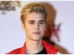 FILE - In this Nov. 7, 2015 file photo, Justin Bieber arrives at the Cannes festival palace in Cannes, southeastern France. Bieber and a former neighbor whose house he egged have agreed to a settlement in a long-running lawsuit. A document filed Friday, Nov. 16, 2018, shows the case has been resolved in its entirety. No details were given about the terms.