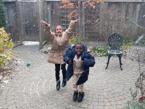 A screengrab from a video shows two Eritrean children reacting gleefully to their first Canadian snowfall. A woman who shared a video says the overwhelming reaction to the clip is reaffirming her faith in the country as a welcoming place for newcomers.