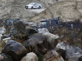 Quebec police sit near a fatal work related accident on Highway 105 near Low Quebec Friday Nov 2, 2018.