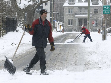 Residents of Ottawa clear out their driveways after a overnight snow storm in Ottawa Friday Nov 17, 2018.
