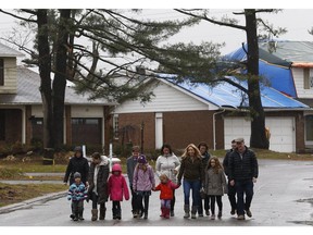 Shannon Mallen and her kids along with some neighbours and friends walk  near their home in Ottawa Tuesday Nov 6, 2018. Shannon and some of her 7 children, along with friends and neighbours, who will be going to After The Storm, the free tornado relief concert at TD Place on Saturday that will raise money for people who have been displaced.