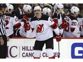 New Jersey Devils' Brian Boyle (11) returns to the bench after getting his third goal of the NHL hockey game in the second period against the Pittsburgh Penguins in Pittsburgh, Monday, Nov. 5, 2018.