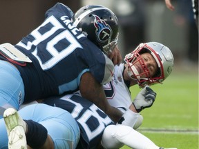 New England Patriots quarterback Tom Brady (12) is sacked by Tennessee Titans defensive end Jurrell Casey (99) and Tennessee Titans linebacker Harold Landry (58) during Tennessee's 34-10 win over New England on Sunday, Nov. 11, 2018, in Nashville, Tenn. (Austin Anthony/Daily News via AP) ORG XMIT: KYBOW209