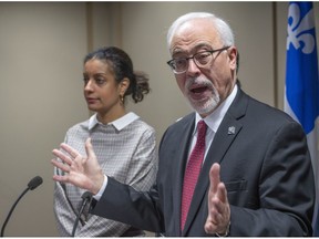 Quebec Liberal financial critic Carlos Leitao responds to a question as Dominique Anglade looks on during a conference in Montreal on Monday, November 26, 2018.
