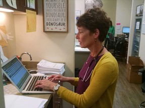 In this undated photo, Dr. Deborah Greenhouse of Palmetto Pediatric in Columbia, S.C., works on her laptop. Greenhouse  is one of several doctors joining a social media storm over guns and doctors, sparking a fight between the physicians and the National Rifle Association.