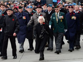 Veterans parade during a Remembrance Day ceremony at the National War Memorial in downtown Ottawa on Nov. 11, 2016.