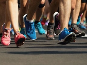 Marathon runners running on city road