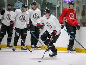 Rookie Drake Batherson, front, practises with the Senators on Tuesday after being called up from Belleville of the AHL. Wayne Cuddington/Postmedia