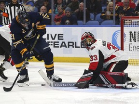 Buffalo Sabres forward Kyle Okposo is stopped by Ottawa Senators goalie Mike McKenna during the third period on Saturday, Nov. 3, 2018, in Buffalo.