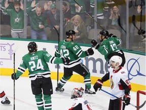 Stars defenceman Taylor Fedun (42) is congratulated by teammate Roope Hintz (24) and Devin Shore (17) after scoring against the Senators in the second period on Friday night..