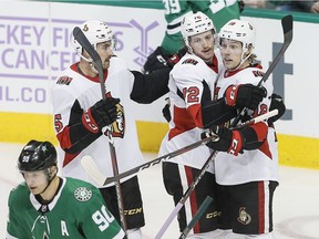 Ottawa Senators forward Ryan Dzingel (18) is congratulated by defencemen Thomas Chabot (72) and Cody Ceci (5) after scoring a goal against the Dallas Stars on Nov. 23. Hockey teams know attendance is tied to performance.