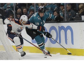 San Jose Sharks center Joe Thornton (19) skates against Edmonton Oilers defenseman Darnell Nurse (25) during the first period of an NHL hockey game in San Jose, Calif., Tuesday, Nov. 20, 2018.
