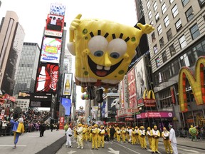 A SpongeBob SquarePants balloon floats through Times Square during the 2010 Macy's Thanksgiving Day Parade in New York. MUST CREDIT: Bloomberg photo by Paul Goguen.