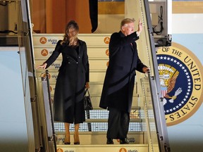 President Donald Trump and first lady Melania Trump alight from Air Force One, after arriving at Orly airport near Paris, Friday, Nov. 9, 2018. Trump is joining other world leaders at centennial commemorations in Paris this weekend to mark the end of World War I.