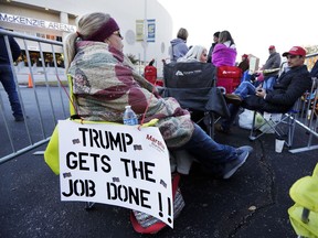 Casey Mchone waits outside McKenzie Arena for a campaign rally with President Donald Trump Sunday, Nov. 4, 2018, in Chattanooga, Tenn. Mchone arrived at the arena at 6:30 a.m. for the 7 p.m. rally.