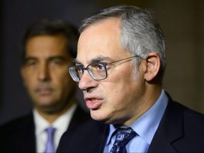 Conservative Shadow Minister for Justice Tony Clement holds a press conference on Parliament Hill in Ottawa on Oct. 22, 2018.