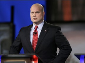 FILE - In this April 24, 2014, file photo, then-Iowa Republican senatorial candidate and former U.S. Attorney Matt Whitaker watches before a live televised debate in Johnston, Iowa. President Donald Trump announced in a tweet that he was naming Whitaker, as acting attorney general, after Attorney General Jeff Sessions was pushed out Nov. 7, 2018, as the country's chief law enforcement officer after enduring more than a year of blistering and personal attacks from Trump over his recusal from the Russia investigation.