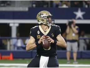 New Orleans Saints quarterback Drew Brees (9) looks to throw against the Dallas Cowboys in the first half of an NFL football game, in Arlington, Texas, Thursday, Nov. 29, 2018.