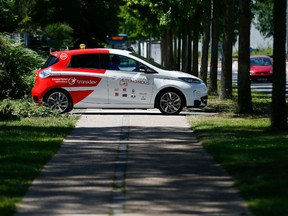 In this file photograph taken on June 26, 2018, an autonomous car drives past during a press presentation in the north-western French city of Sotteville-lès-Rouen, near Rouen. - In the not-too-distant future, driverless cars may have to choose between saving their passengers or pedestrians when faced with unavoidable accidents. But how should they decide?