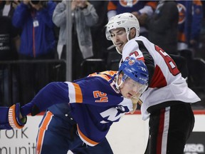 Senators defenceman Ben Harpur fights with Scott Mayfield of the Islanders during last Friday's game in Brooklyn, N.Y.