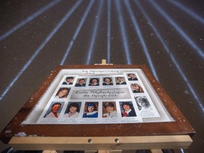 Fourteen lights shine skyward at a vigil honouring the victims of the 1989 Ecole Polytechnique attack on Thursday, Dec. 6, 2018 in Montreal.