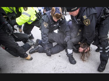 Groups opposed to Canada’s support of the UN Global Compact for Safe, Orderly and Regular Migration held a rally to protest the United Nation Global Compact for Migration while anti-fascism and anti-racism activists counter-protested, Saturday, Dec. 8, 2018 on Parliament Hill. One of multiple anti-fascism and anti-racism activists who were detained when the protest erupted.