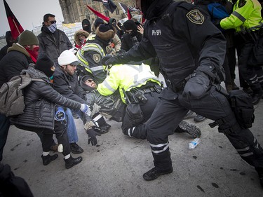 Groups opposed to Canada’s support of the UN Global Compact for Safe, Orderly and Regular Migration held a rally to protest the United Nation Global Compact for Migration while anti-fascism and anti-racism activists counter-protested, Saturday, Dec. 8, 2018 on Parliament Hill. Anti-fascism and anti-racism activists clash with RCMP and PPS authorities.