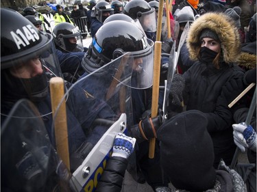 Groups opposed to Canada’s support of the UN Global Compact for Safe, Orderly and Regular Migration held a rally to protest the United Nation Global Compact for Migration while anti-fascism and anti-racism activists counter-protested, Saturday, Dec. 8, 2018 on Parliament Hill. Anti-fascism and anti-racism activists clash with RCMP and PPS authorities.