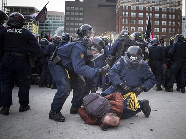 Groups opposed to Canada’s support of the UN Global Compact for Safe, Orderly and Regular Migration held a rally to protest the United Nation Global Compact for Migration while anti-fascism and anti-racism activists counter-protested, Saturday, Dec. 8, 2018 on Parliament Hill. One of multiple anti-fascism and anti-racism activists who were detained when the protest erupted.