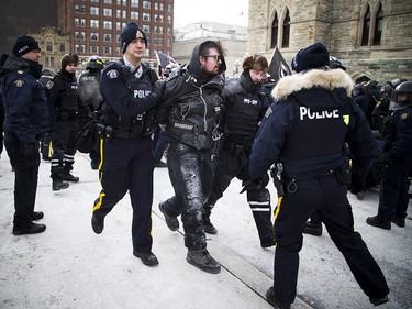 Groups opposed to Canada’s support of the UN Global Compact for Safe, Orderly and Regular Migration held a rally to protest the United Nation Global Compact for Migration while anti-fascism and anti-racism activists counter-protested, Saturday, Dec. 8, 2018 on Parliament Hill. One of multiple anti-fascism and anti-racism activists who were detained when the protest erupted.