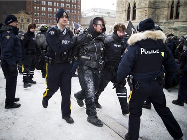 Groups opposed to Canada’s support of the UN Global Compact for Safe, Orderly and Regular Migration held a rally to protest the United Nation Global Compact for Migration while anti-fascism and anti-racism activists counter-protested, Saturday, Dec. 8, 2018 on Parliament Hill. One of multiple anti-fascism and anti-racism activists who were detained when the protest erupted.