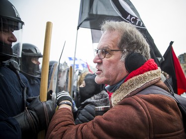 Groups opposed to Canada’s support of the UN Global Compact for Safe, Orderly and Regular Migration held a rally to protest the United Nation Global Compact for Migration while anti-fascism and anti-racism activists counter-protested, Saturday, Dec. 8, 2018 on Parliament Hill. Anti-fascism and anti-racism activists clash with RCMP and PPS authorities.