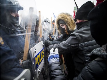 Groups opposed to Canada’s support of the UN Global Compact for Safe, Orderly and Regular Migration held a rally to protest the United Nation Global Compact for Migration while anti-fascism and anti-racism activists counter-protested, Saturday, Dec. 8, 2018 on Parliament Hill. Anti-fascism and anti-racism activists clash with RCMP and PPS authorities.