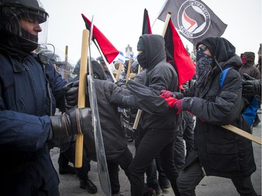 Groups opposed to Canada’s support of the UN Global Compact for Safe, Orderly and Regular Migration held a rally to protest the United Nation Global Compact for Migration while anti-fascism and anti-racism activists counter-protested, Saturday, Dec. 8, 2018 on Parliament Hill. Anti-fascism and anti-racism activists clash with RCMP and PPS authorities.