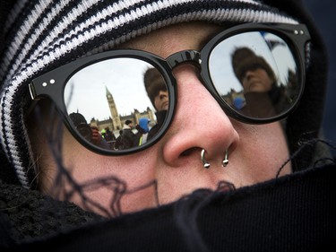 Groups opposed to Canada’s support of the UN Global Compact for Safe, Orderly and Regular Migration held a rally to protest the United Nation Global Compact for Migration while anti-fascism and anti-racism activists counter-protested, Saturday, Dec. 8, 2018 on Parliament Hill. An anti-fascism and anti-racism activist.