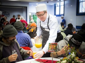 Mayor Jim Watson was on juice duty at The Ottawa Mission's Christmas dinner.
