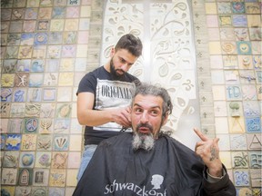 Shawn Dooley was happy to get a hair cut by Jamal Alattar  Saturday December 22, 2018 at the Ottawa Mission. Humans for Peace Institution organized, for the second year, an initiative "Refugees for Peace - Haircuts for Kindness," refugees providing free haircuts.   Ashley Fraser/Postmedia