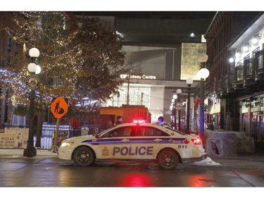 Police attend the scene of a shooting near the Rideau Centre in Ottawa on Sunday, December 23, 2018.   (Patrick Doyle)  ORG XMIT: 1224 rideau shooting 02