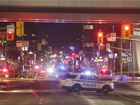 Police attend the scene of a shooting near the Rideau Centre in Ottawa on Sunday, December 23, 2018.
