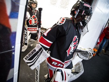 Nepean Raiders goalie #1 Callum Clare heads out to the ice with his team.