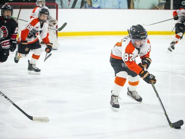 Philadelphia Little Flyers #87 Emmett Wheatley brings the puck down the ice.