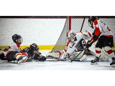 Philadelphia Little Flyers goalie Grant Gale makes a save.