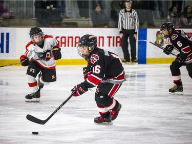 Nepean Raiders #16 Thomas Vandenberg brings the puck down the ice.