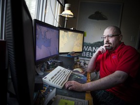 Steffan Watkins tracks ships and aircraft by their transponders at his home workstation near Carp.