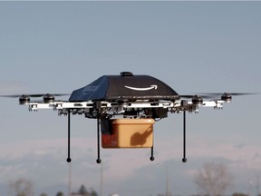 This undated handout photo released by Amazon shows a flying "octocopter" mini-drone that would be used to fly small packages to consumers.  Amazon said December 14, 2016it completed its first delivery by drone, in what the global online giant hopes will be a trend in automated shipments by air.