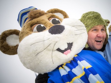 The National Capital Commission launched the Rideau Canal Skateway's 49th season by opening a 2.7-kilometre section Sunday, Dec. 30, 2018. David Cork snuggles up for a photo with one of the Ice Hogs Sunday morning.